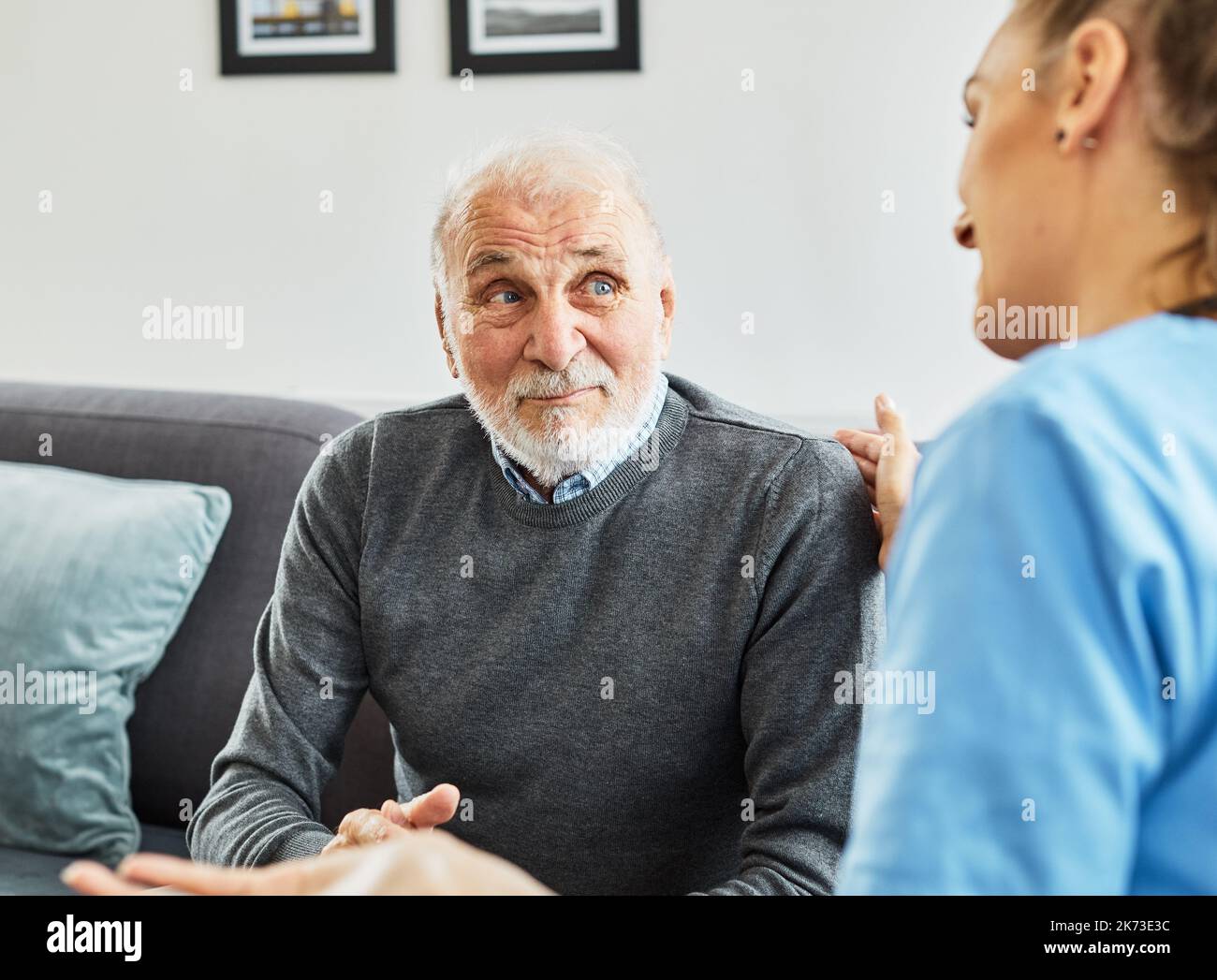 nurse doctor senior care caregiver help assistence retirement home nursing elderly sad depression alone loneliness health support Stock Photo