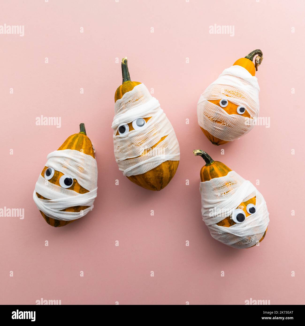 Hallowwen holiday background concept. Gourd pumpkins dressed as scary