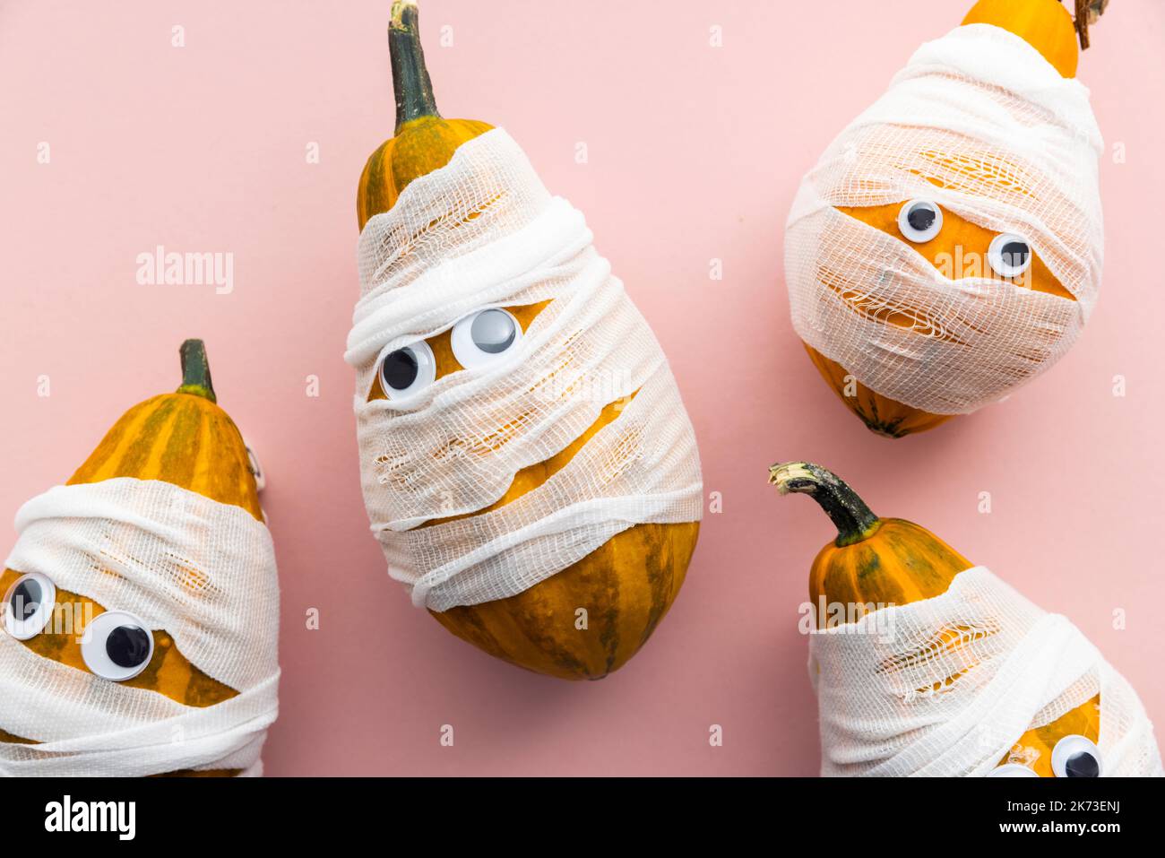 Hallowwen holiday background concept. Gourd pumpkins dressed as scary