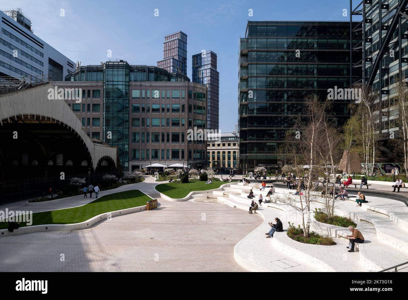 Wide view across square with city in background. Exchange Square, London, United Kingdom. Architect: DSDHA, 2022. Stock Photo