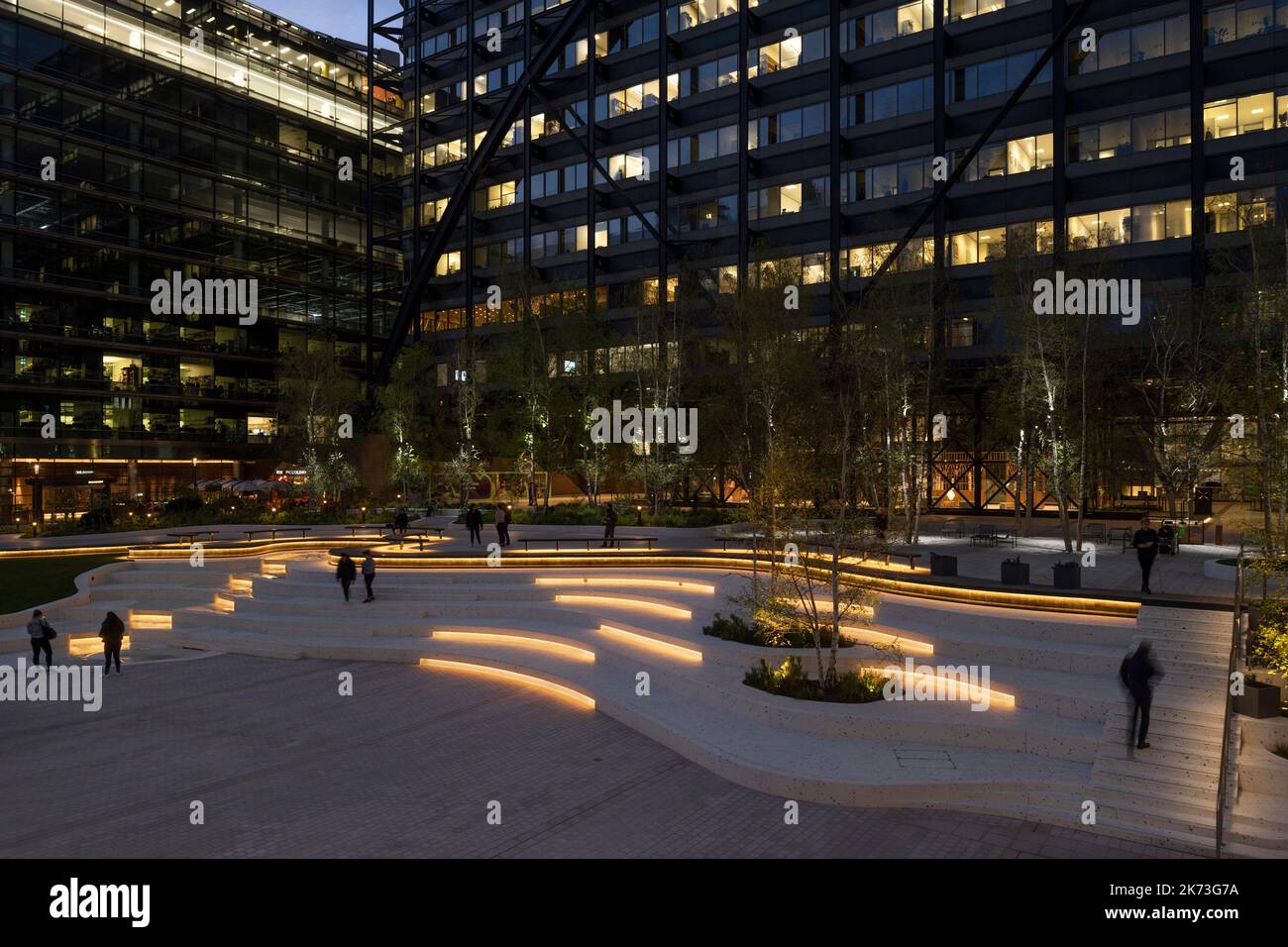 Evening wide view across square with city in background. Exchange Square, London, United Kingdom. Architect: DSDHA, 2022. Stock Photo