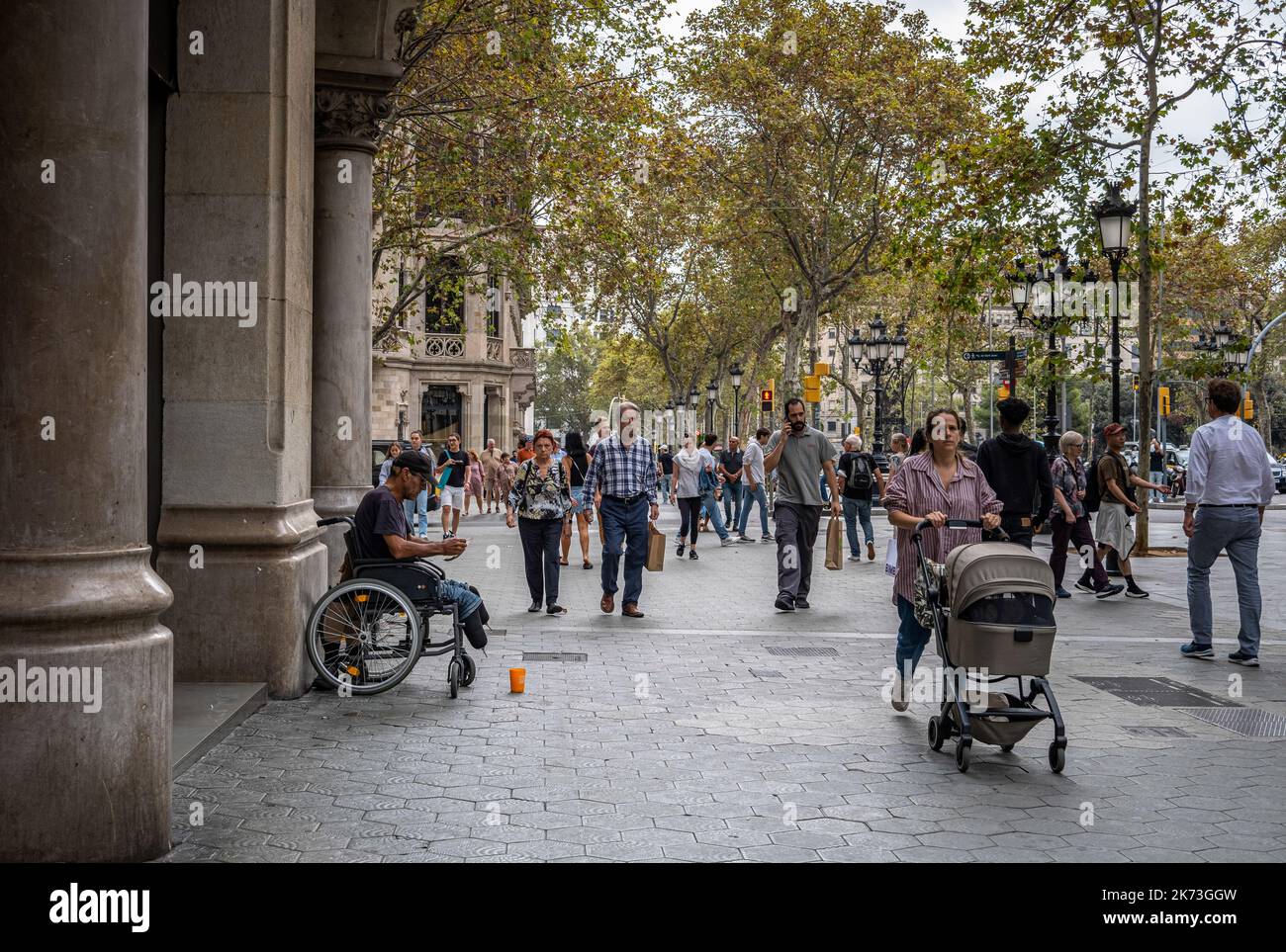 Barcelona, Spain. 17th Oct, 2022. A disabled man seen in a wheelchair begging in Passeig de