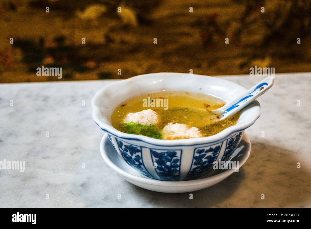 An appetiser of Crab and Chicken Meatballs in chicken consomme Stock Photo Alamy