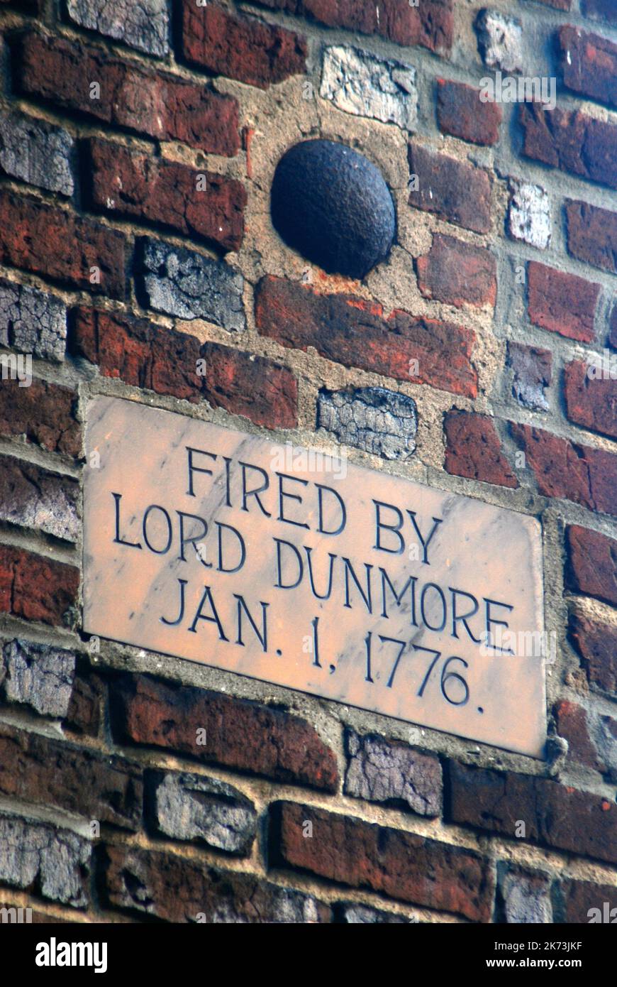 A cannonball, fired by a British general during the American Revolution is lodged in the brick exterior wall of St Paul's Church in Norfolk, Virginia Stock Photo