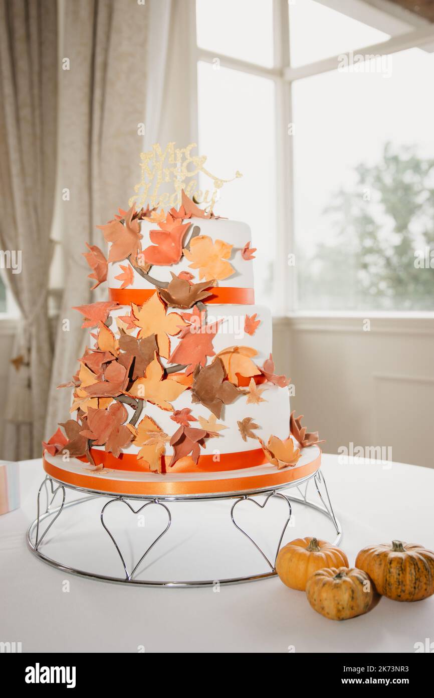Autumn Wedding Cake covered in sweet fall coloured leaves Stock Photo