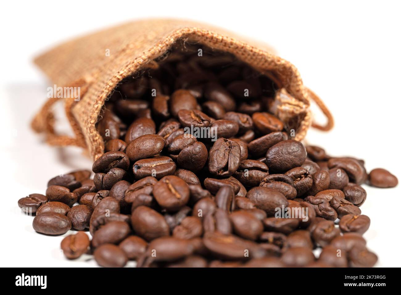 Roasted coffee beans in a jute sack Stock Photo