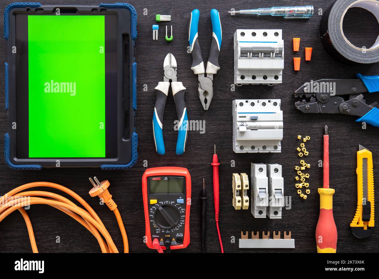 Different electrical tools on wooden background, flat lay. Stock Photo