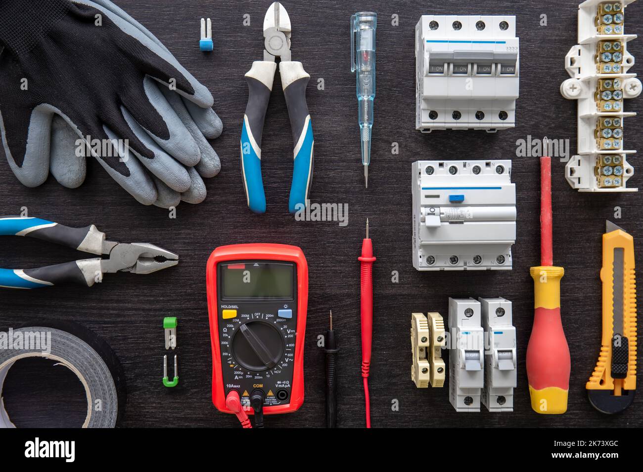 Different electrical tools on wooden background, flat lay. Stock Photo