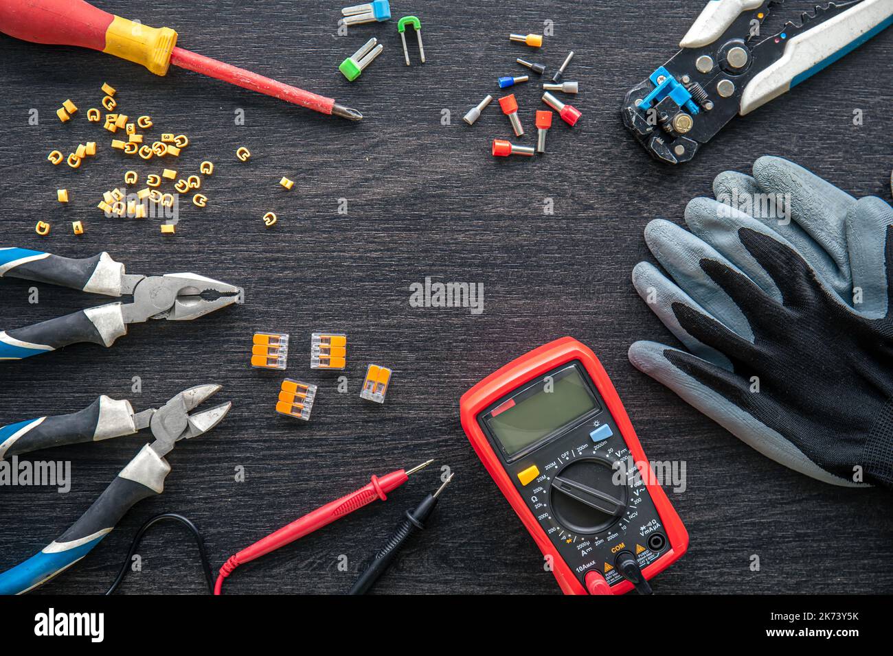 Different electrical tools on wooden background, flat lay. Stock Photo