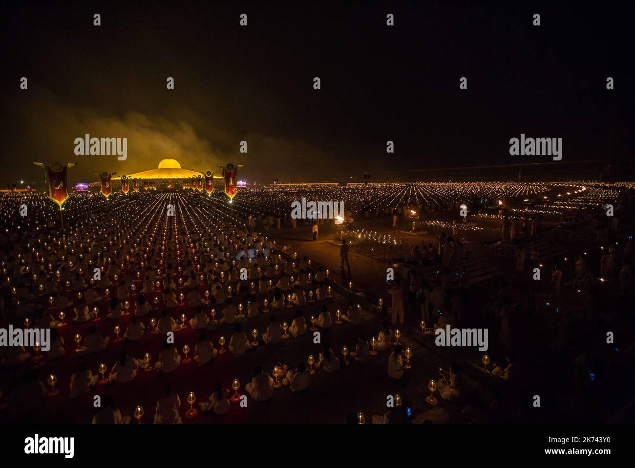 A general view of the Wat Phra Dhammakaya Temple during the yearly ceremony at in the north of Bangkok, Thailand on February 11, 2016. Thai people celebrate the buddhist festival of clockwise circumambulation and Makha pratipa lantern lighting ceremony at Dhammakaya Temple on 'Makha Bucha Day' during the third lunar moon, where around 1250 monks gathered to be ordained by the Buddha. Stock Photo