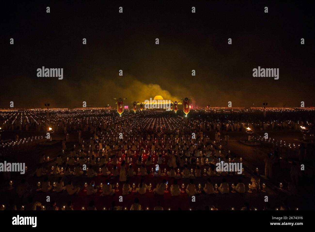 A general view of the Wat Phra Dhammakaya Temple during the yearly ceremony at in the north of Bangkok, Thailand on February 11, 2016. Thai people celebrate the buddhist festival of clockwise circumambulation and Makha pratipa lantern lighting ceremony at Dhammakaya Temple on 'Makha Bucha Day' during the third lunar moon, where around 1250 monks gathered to be ordained by the Buddha. Stock Photo
