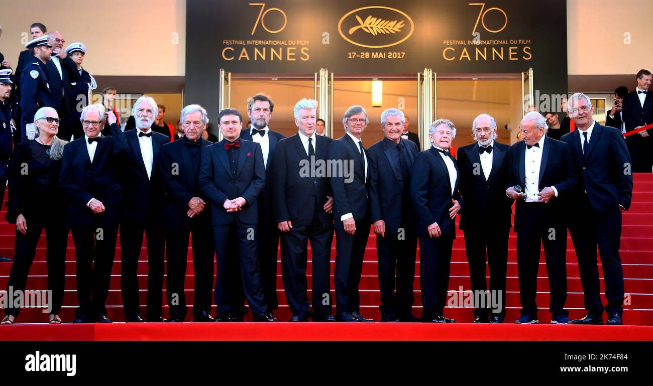 ; (FromL) New Zealander director Jane Campion, British director Ken Loach, Austrian director Michael Haneke, Greek director Costa-Gavras, Romanian director Cristian Mungiu, Italian director Nanni Moretti, US director David Lynch, Swedish director Bille August, French director Claude Lelouch, French-Polish director Roman Polanski, US director Jerry Schatzberg, Algerian director Mohammed Lakhdar-Hamina and French director Laurent Cantet pose as they arrive on May 23, 2017 for the '70th Anniversary' ceremony of the Cannes Film Festival in Cannes, southern France.   70th annual Cannes Film Festiv Stock Photo