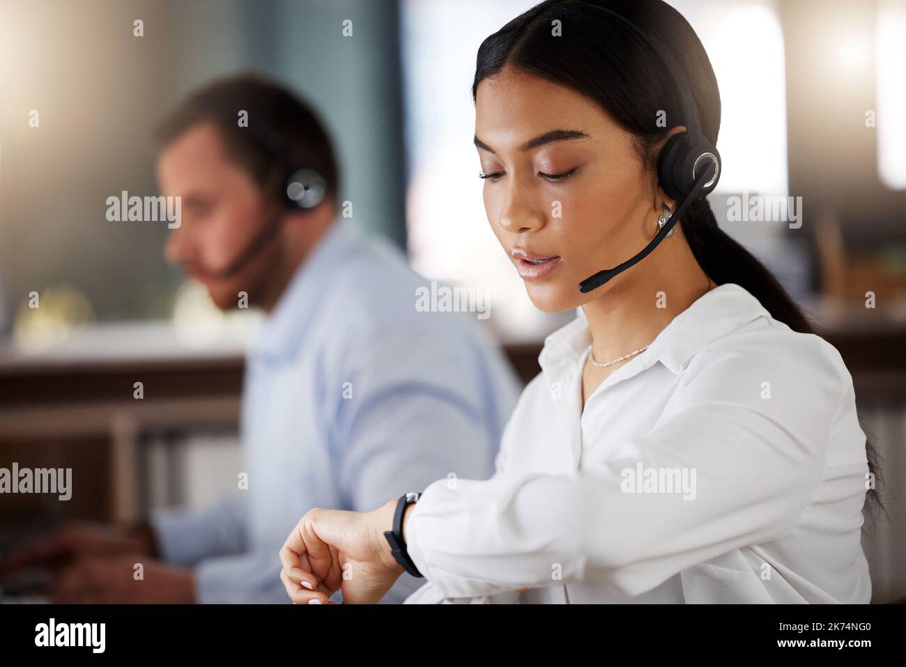 Woman checking clock office hi-res stock photography and images - Alamy