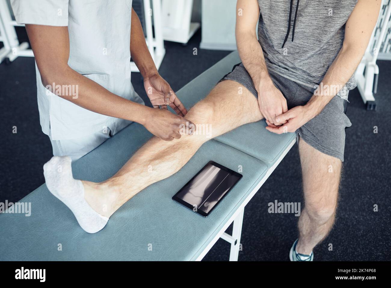 High angle view of massage therapist making massage to patient on couch Stock Photo