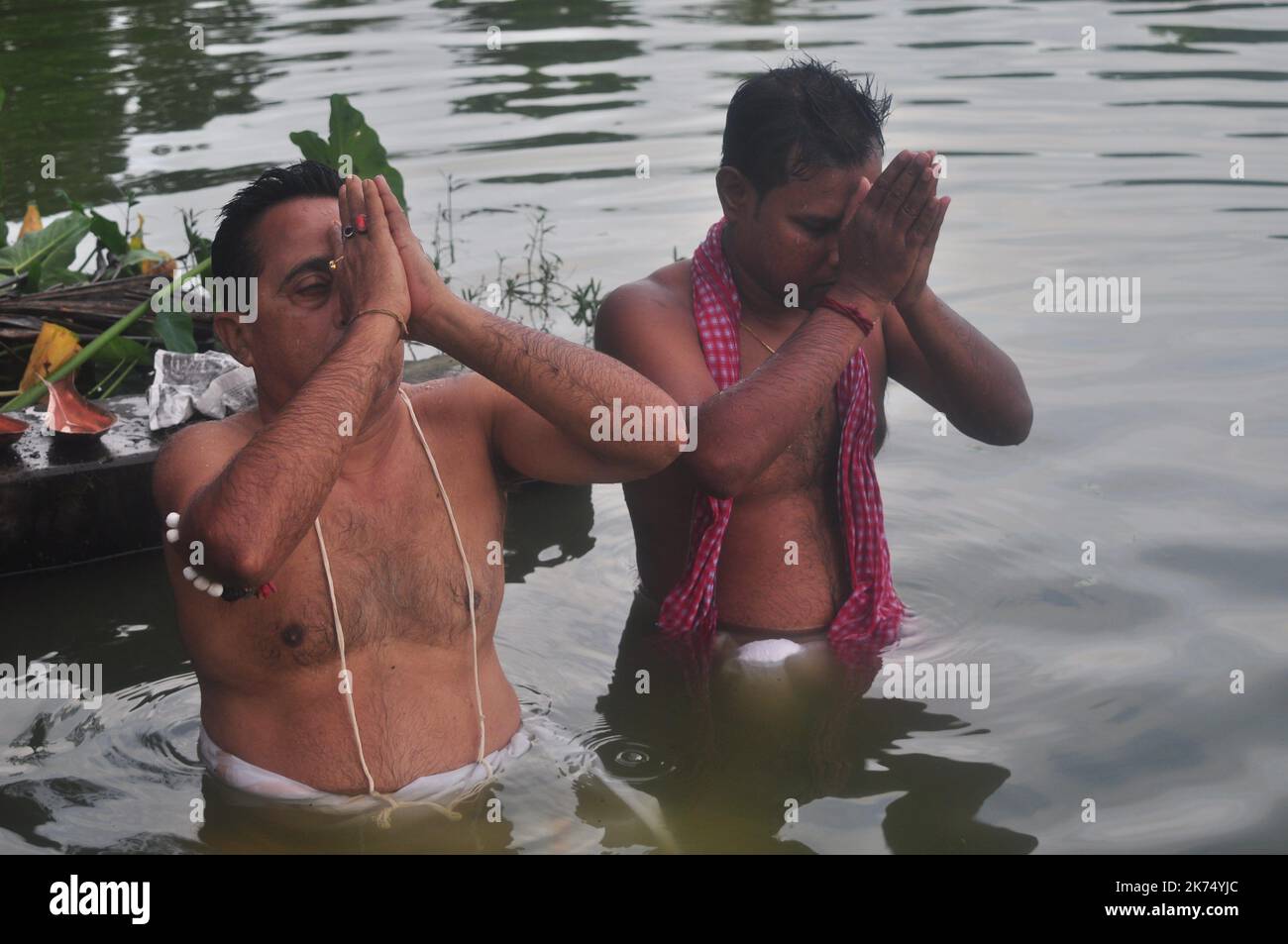 Indian Hindu devotees perform Tarpan, also known as Pitritarpan in Tripura. Tarpan is a ritual to pay obeisance to one's forfathers, and on its last day on September 19, 2017, they prayed their ancestors. In Hindu mythology, this day is also called -Mahalaya- and described as the day when the Gods created the ten armed Godess Durga to destroy the demon king Asur who plotted to drive out the gods from their kingdom. During this five-day period, they worship of Durga, who is recognized as the destroyer of evil. Stock Photo