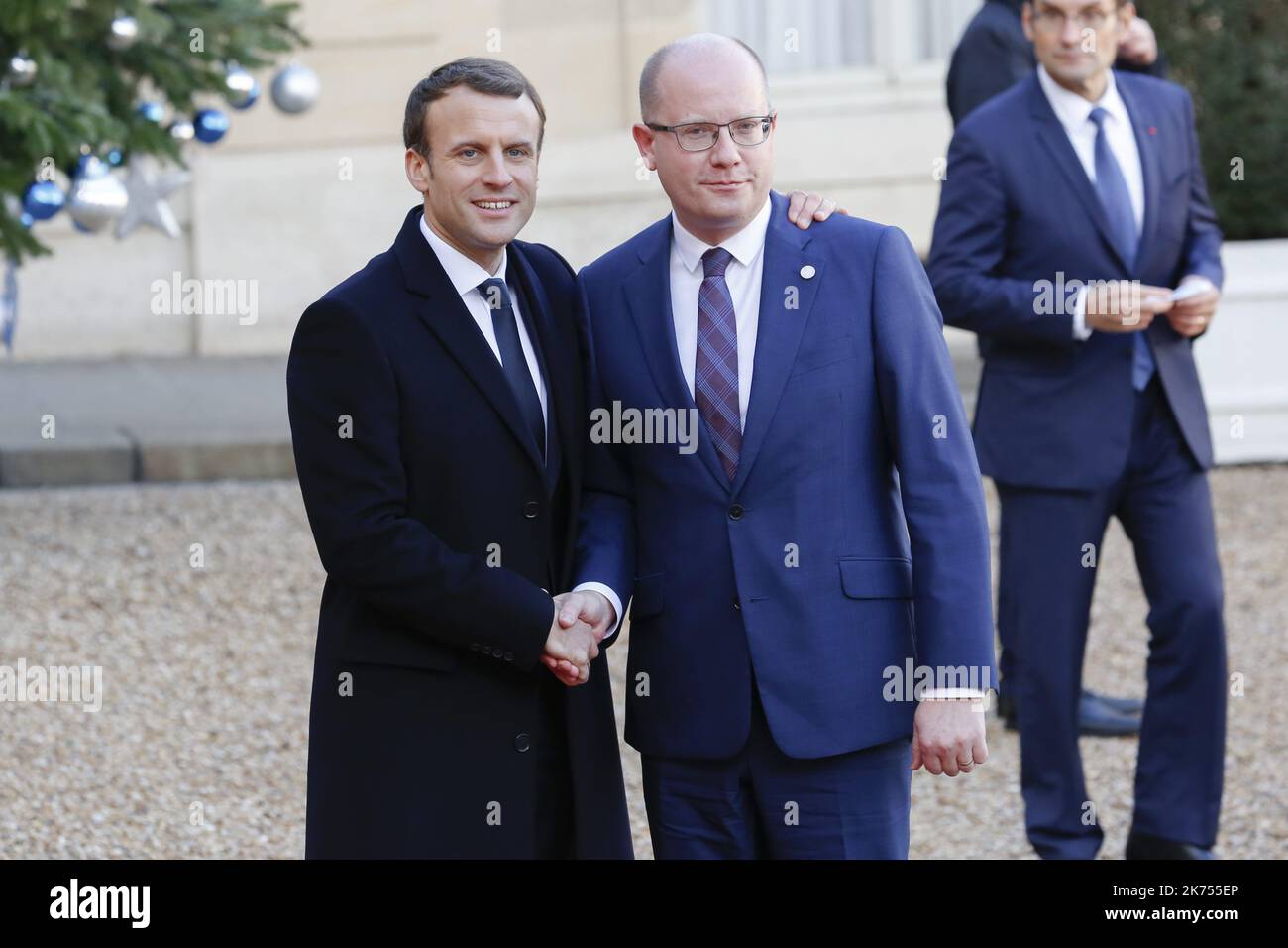 French President Emmanuel Macron welcomes Prime Minister of the Czech Republic Bohuslav Sobotka as he arrives at the Elysee palace in Paris, for a lunch hosted by the French President as part of the One Planet Summit.  Macron is hosting the One Planet climat summit, which gathers world leaders, philantropists and other committed private individuals to discuss climate change. 12.12.2017 Stock Photo