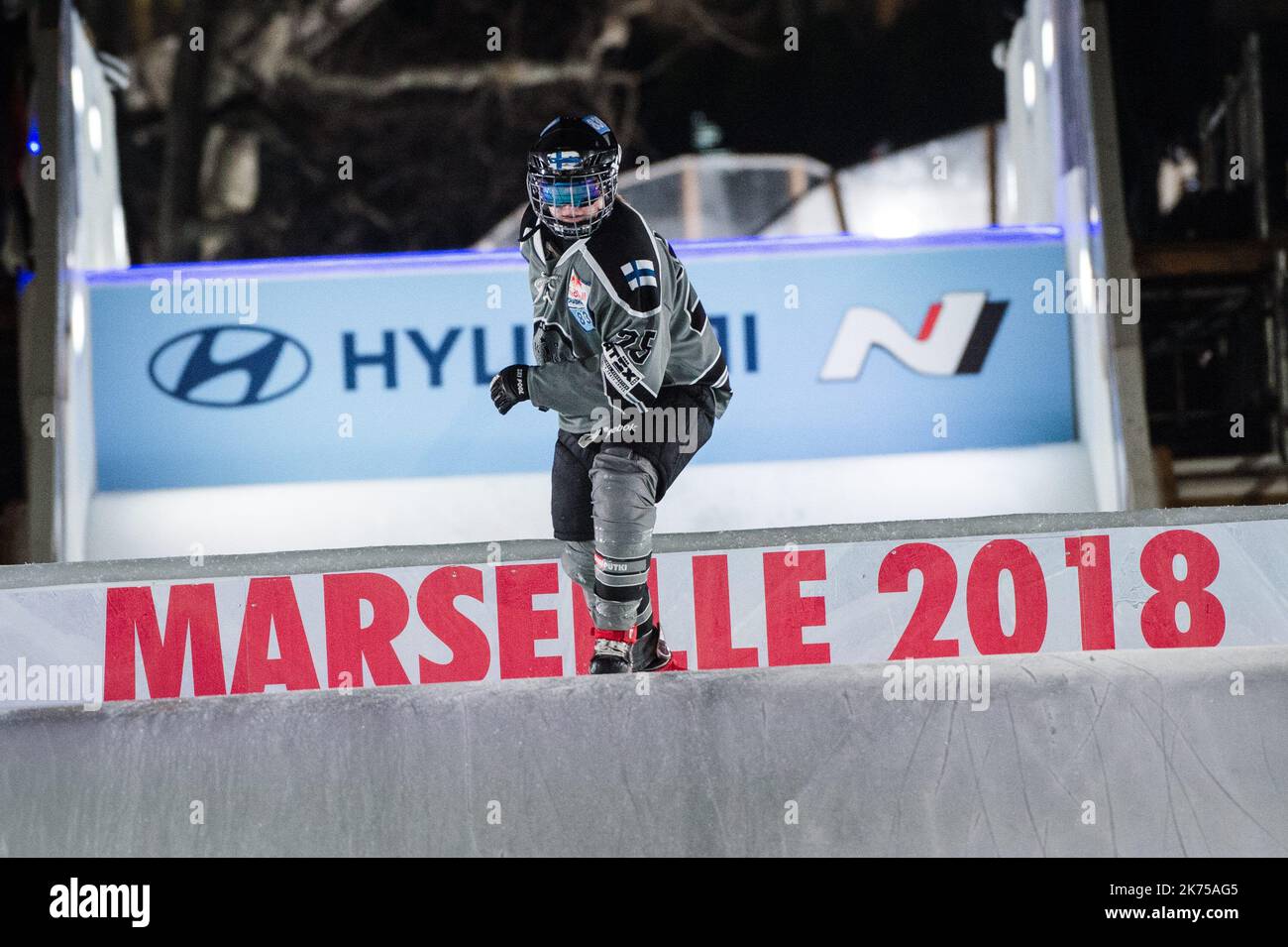 Ice skaters compete in the final of the Redbull Crashed Ice, the Ice Cross Downhill World Championship, in Marseille, southern France Stock Photo