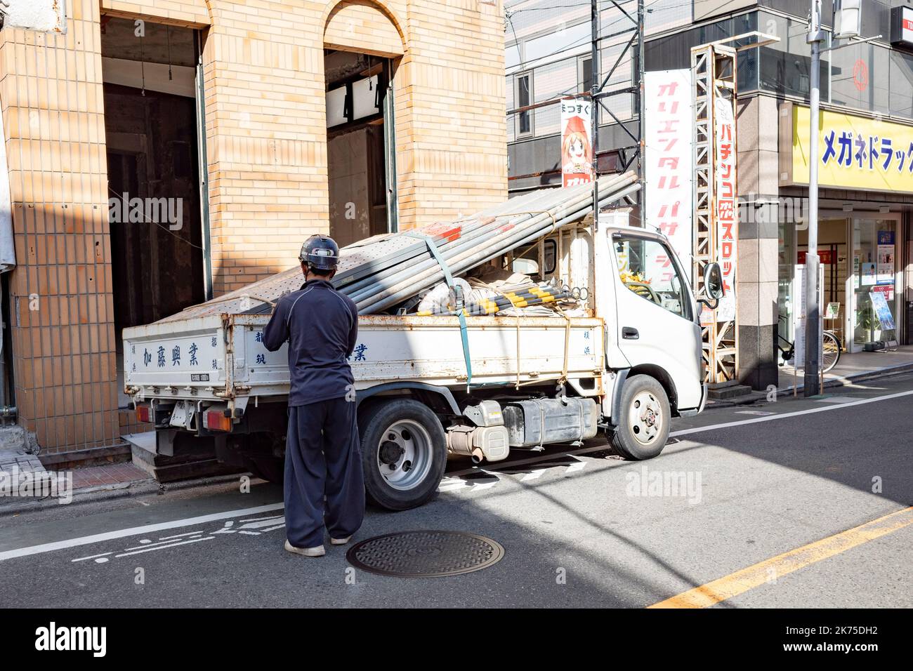 Tokyo, Japan. 4th Oct, 2022. A construction worker offloading ...