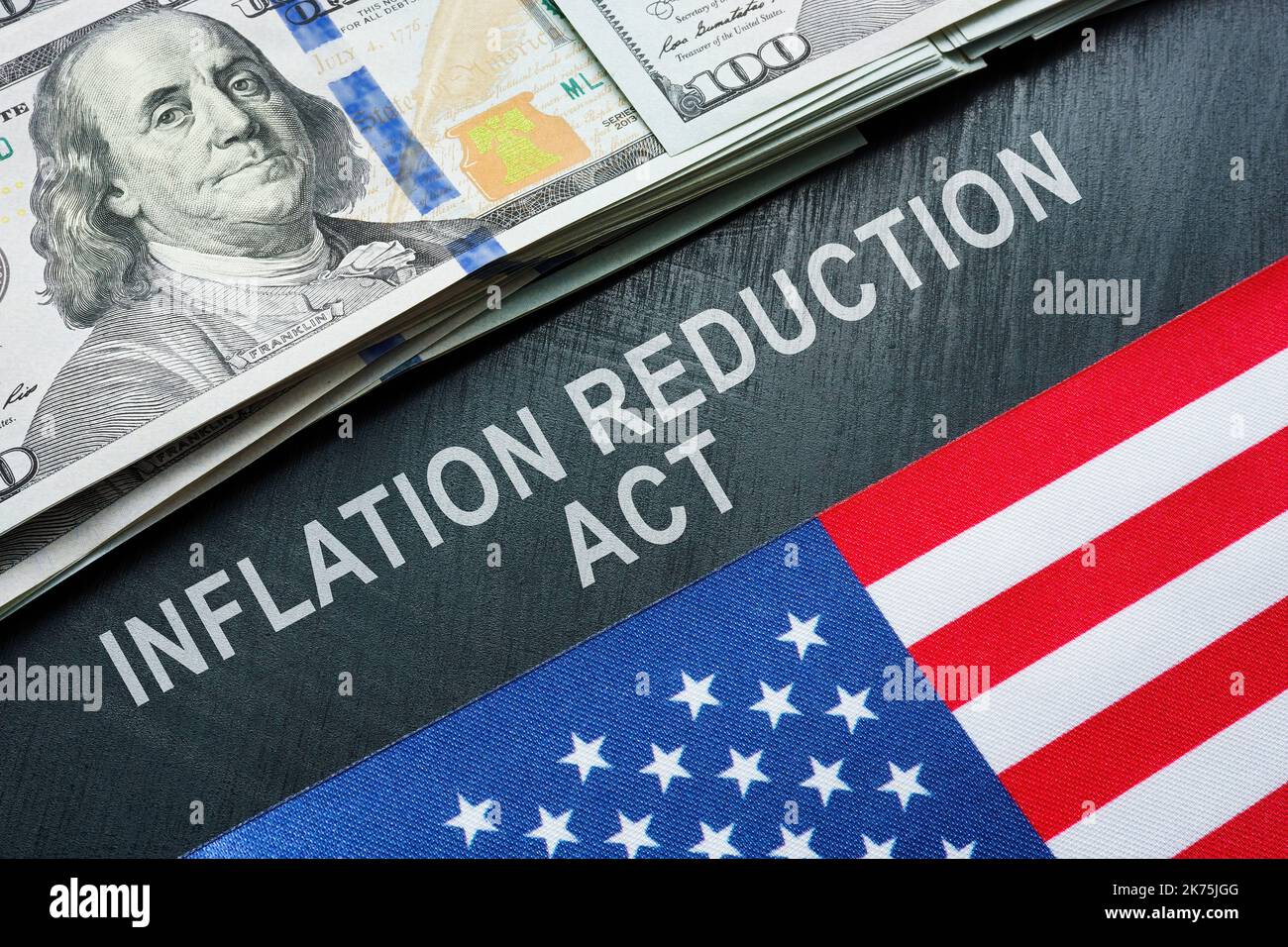 USA flag, dollars and inscription inflation reduction act Stock Photo