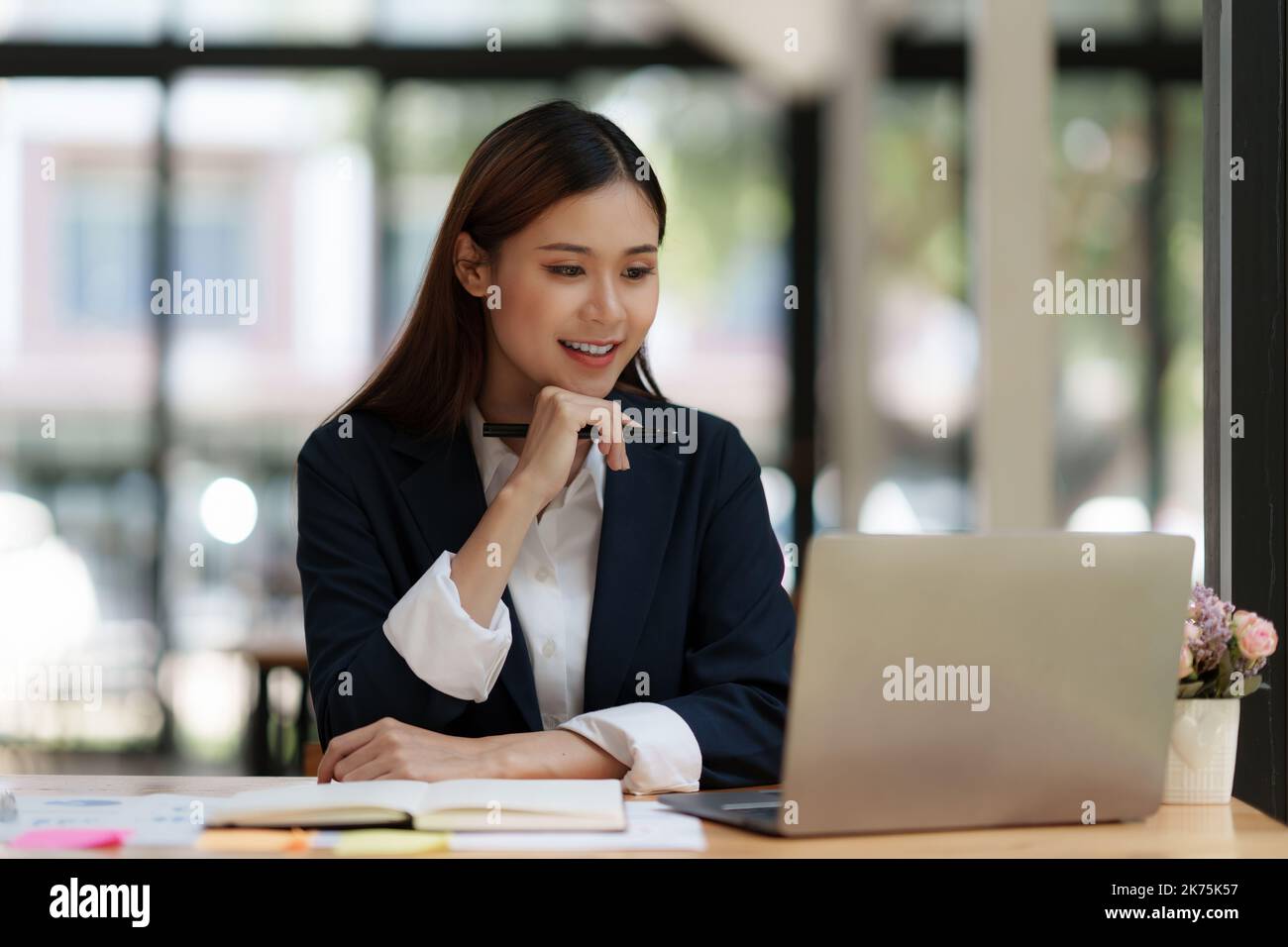 Consult financial concept. Business man pointing at paperwork and using calculator Stock Photo