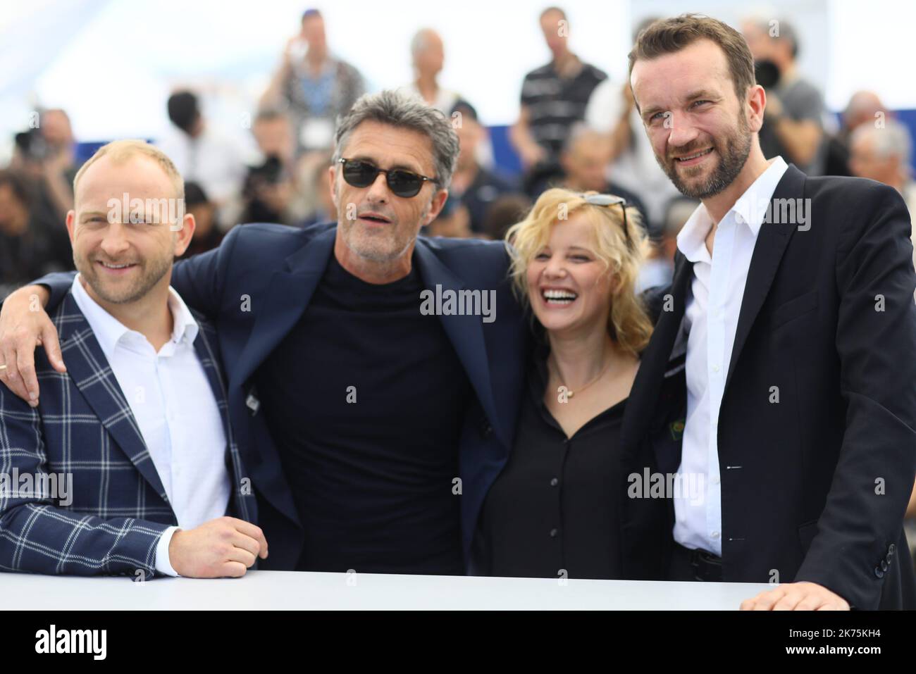 (FromL) Polish director Pawel Pawlikowski, Polish actress Joanna Kulig and Polish actor Tomasz Kot pose on May 11, 2018 during a photocall for the film 'Cold War (Zimna Wojna)' at the 71st edition of the Cannes Film Festival in Cannes, southern France. Stock Photo