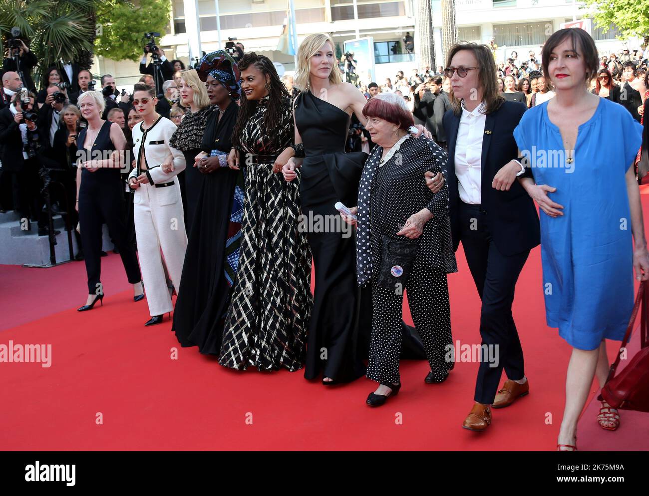 - (FromL) Burundian singer and member of the Feature Film Jury Khadja Nin, US director and screenwriter and member of the Feature Film Jury Ava DuVernay, Australian actress Cate Blanchett, French director Agnes Varda and French director Celine Sciamma walk the red carpet in protest of the lack of female filmmakers honored throughout the history of the festival at the screening of 'Girls Of The Sun (Les Filles Du Soleil)' during the 71st annual Cannes Film Festival at the Palais des Festivals on May 12, 2018 in Cannes, southeastern France.  Only 82 films in competition in the official selection Stock Photo