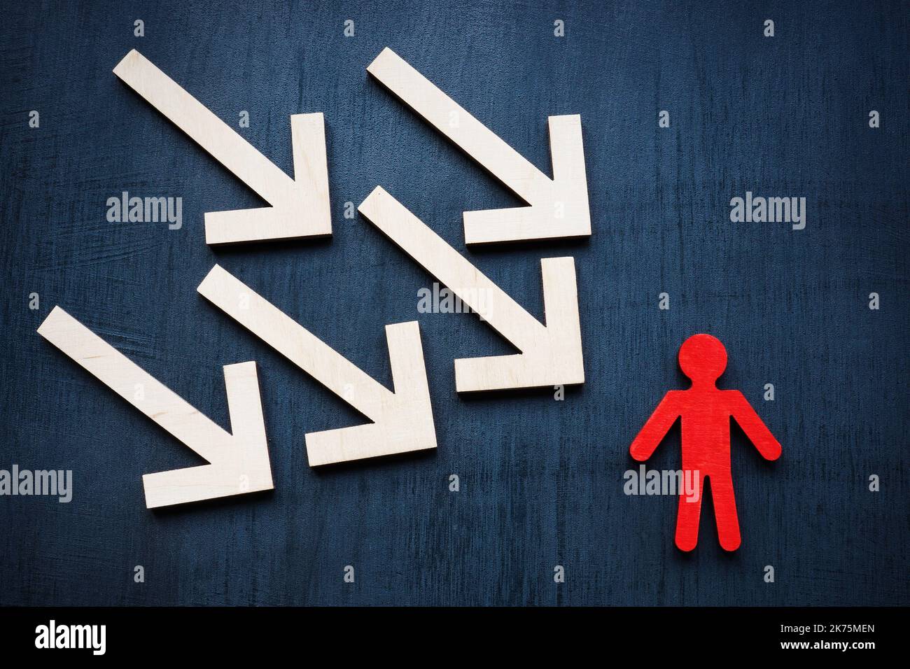 Assertiveness and resilience concept. Arrows and red figurine. Stock Photo