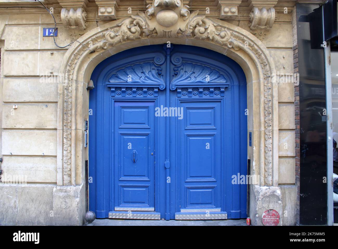 A beautiful blue wooden doorway and grand entrance located on the Rue des Lavandières Sainte-Opportune in the 1st arrondissement of Paris France. Stock Photo