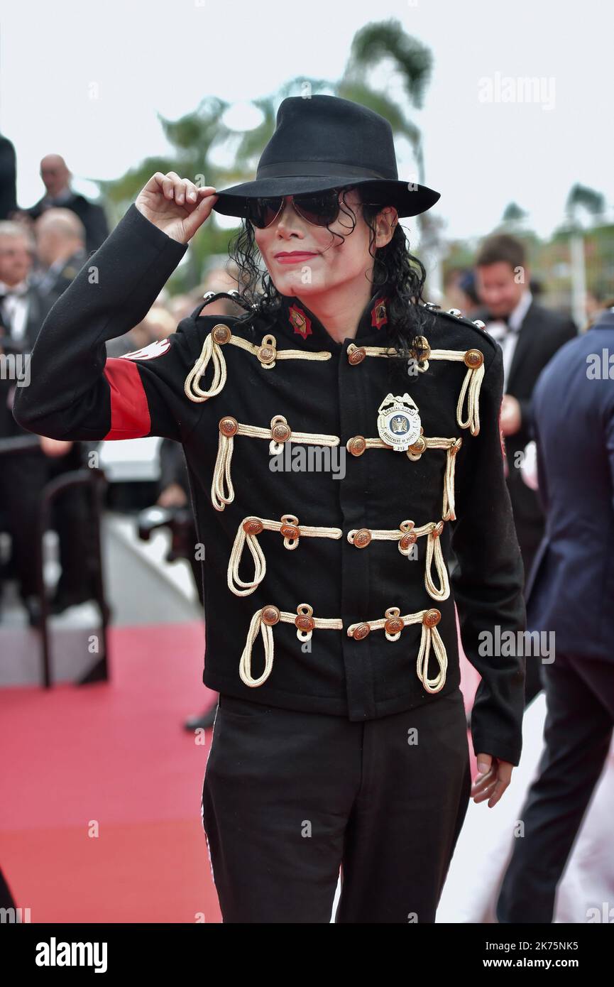 A Michael Jackson impersonator attends the screening of 'Solo: A Star Wars Story' during the 71st annual Cannes Film Festival at Palais des Festivals on May 15, 2018 in Cannes, France. Stock Photo