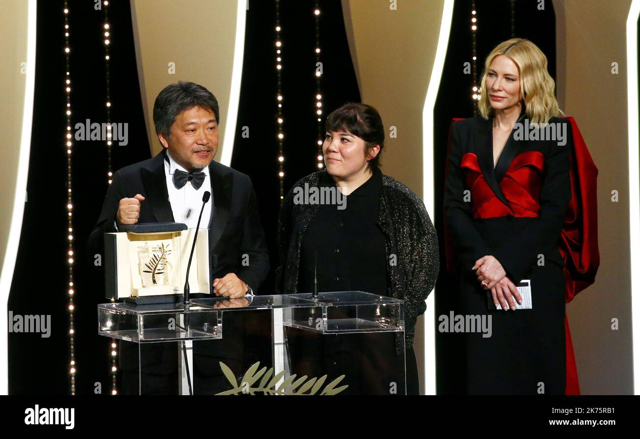 Japanese director Hirokazu Kore-Eda poses on stage with Australian actress and President of the Jury Cate Blanchett after he was awarded with the Palme d'Or for the film 'Shoplifters (Manbiki Kazoku)' on May 19, 2018 during the closing ceremony of the 71st edition of the Cannes Film Festival in Cannes, southern France.   71st annual Cannes Film Festival in Cannes, France, May 2018. The film festival will run from 8 to 19 May. Stock Photo