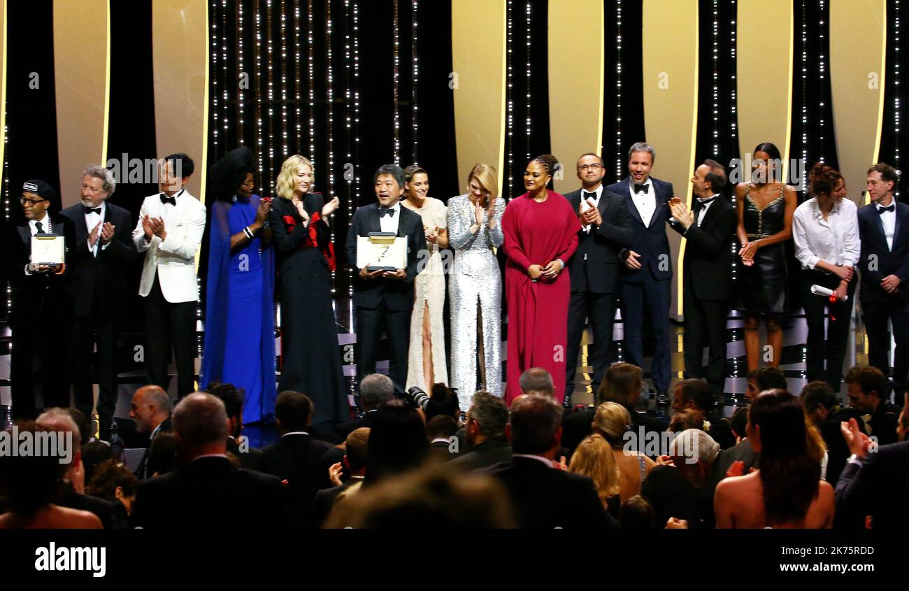 Japanese director Hirokazu KoreEda (C) shakes hands with Australian actress and President of