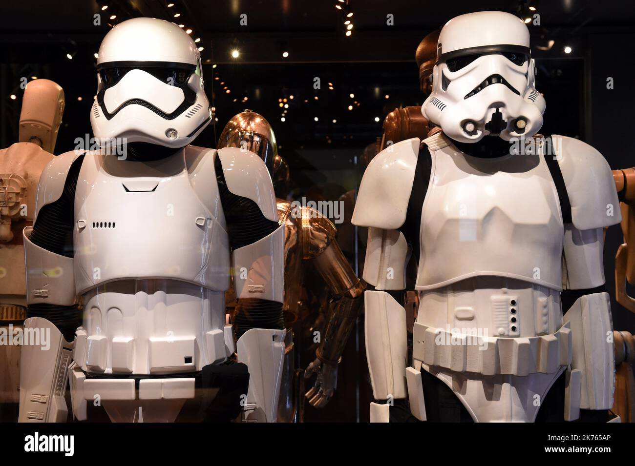 Stormtrooper Costumes (D) of Episode VI The Return of the Jedi (1983) and Stormtrooper of the First Order (G) of episode VII The Force Awakens (2015) in the Star Wars Identities exhibit. Stock Photo