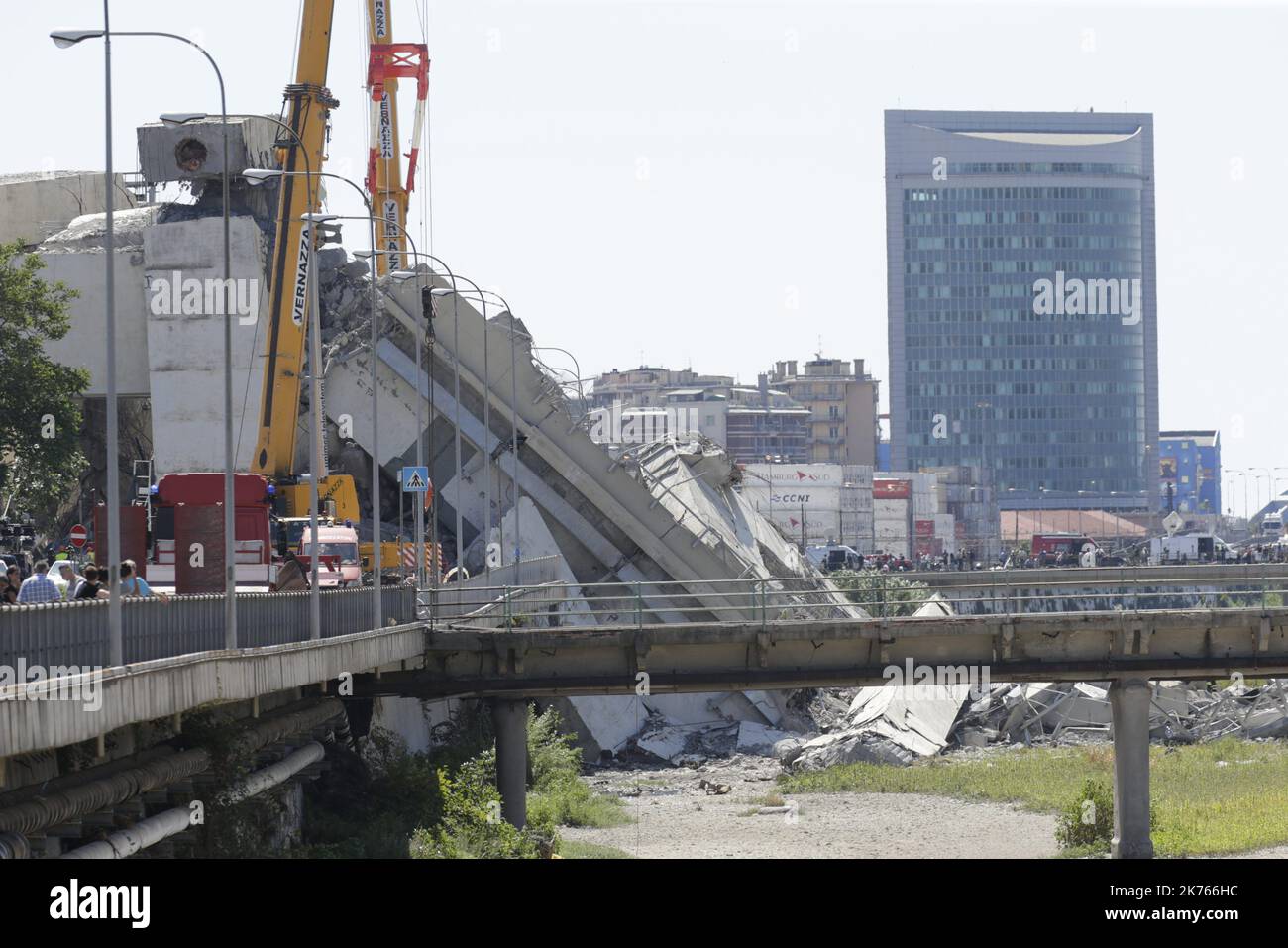 A collapsed bridge over the A10 highway in Genoa, Italy, 14 August 2018. At least 30 people are believed to have died as a large section of the Morandi viaduct upon which the A10 motorway runs collapsed in Genoa on Tuesday. Stock Photo