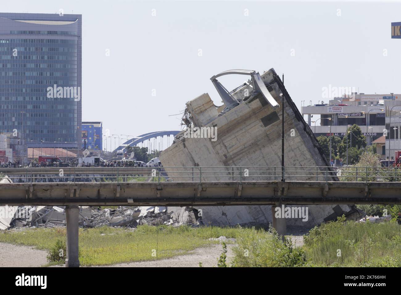 A collapsed bridge over the A10 highway in Genoa, Italy, 14 August 2018. At least 30 people are believed to have died as a large section of the Morandi viaduct upon which the A10 motorway runs collapsed in Genoa on Tuesday. Stock Photo