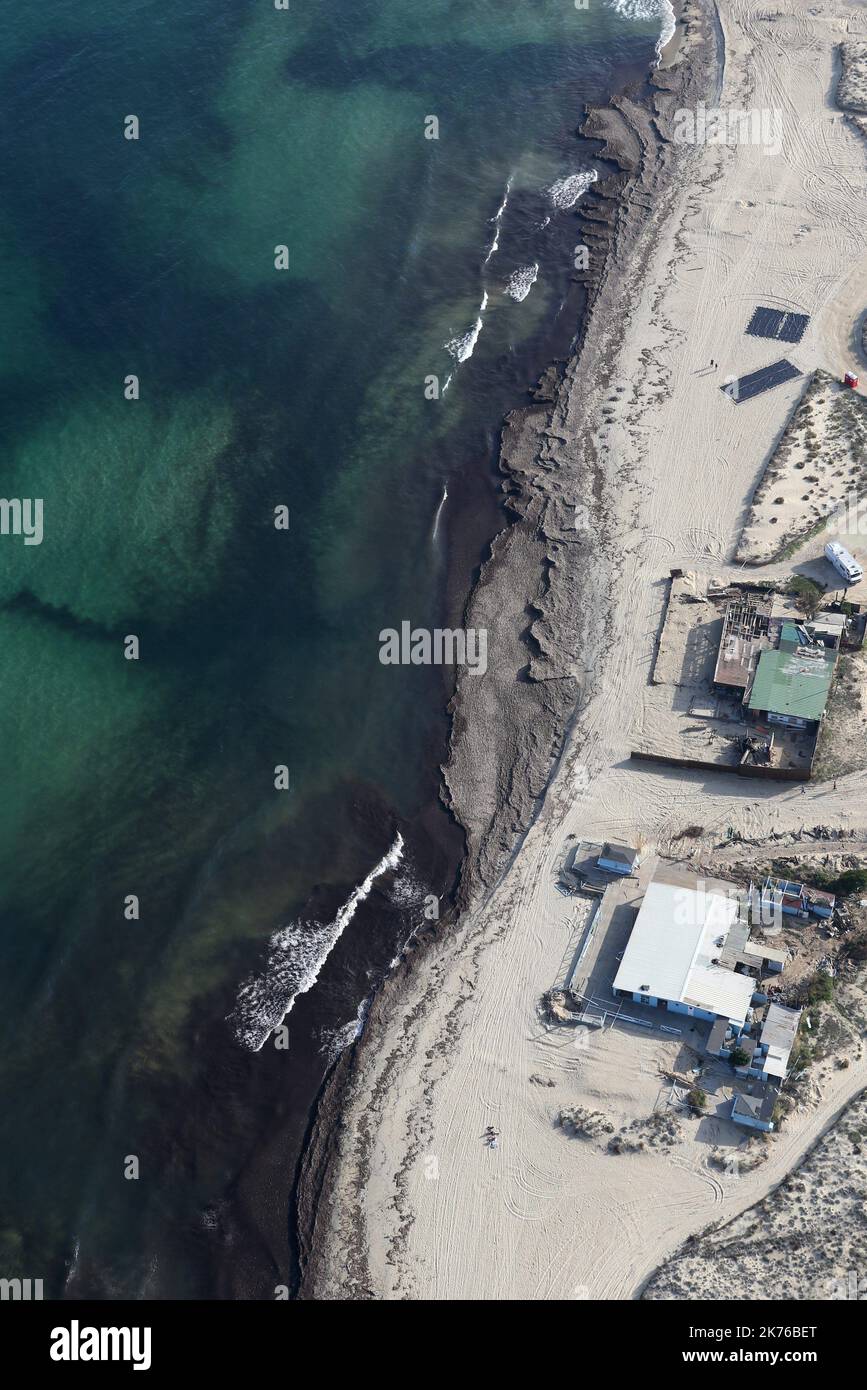 After the collision between two cargo ships off the Mediterranean island of Corsica, tar balls have been located polluting the beaches of the east of the Var, including the famous Pampelonne beach in the Gulf of Saint-Tropez on October 19, 2018. Stock Photo