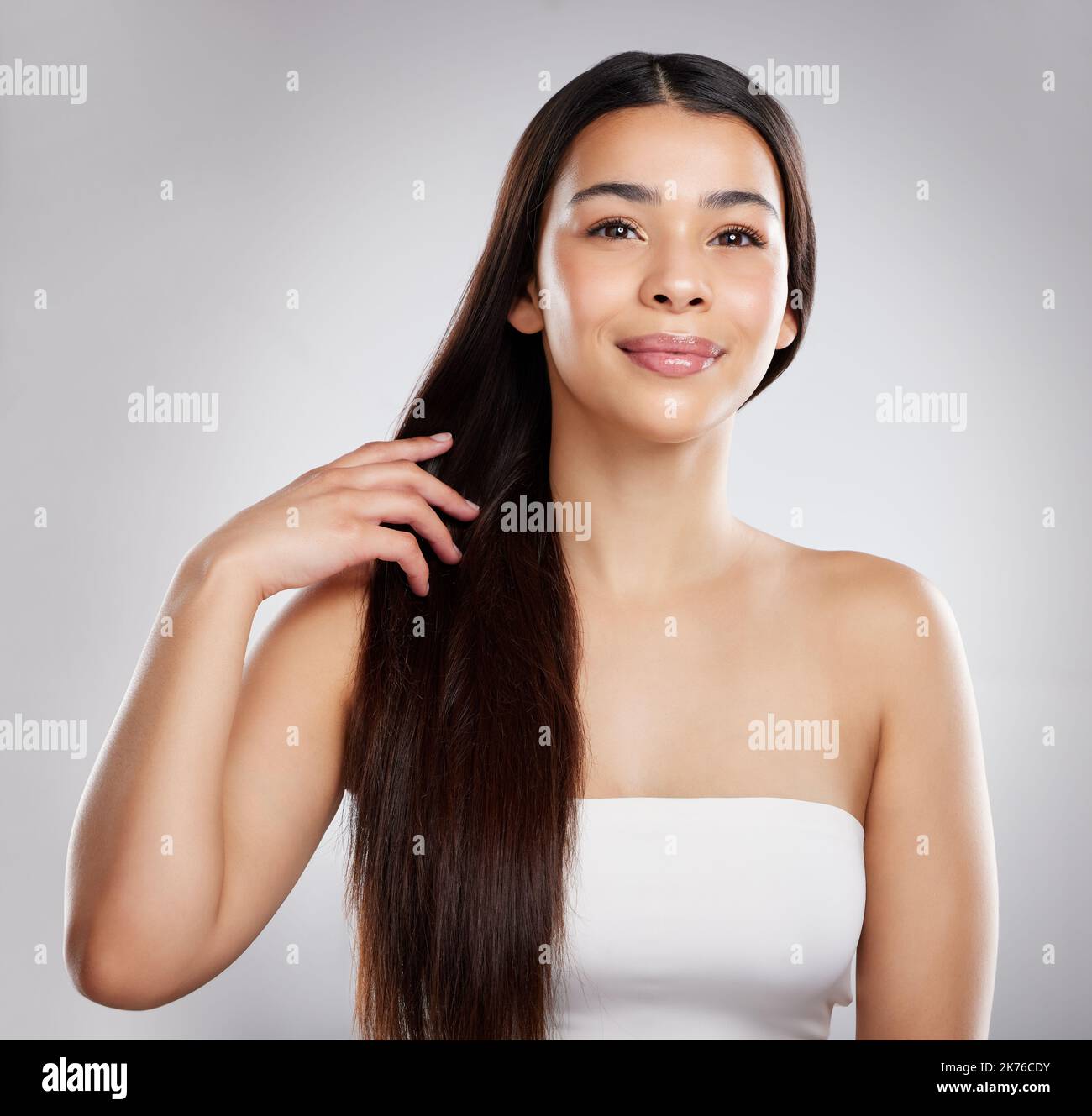My hair is filled with so much moisture. Studio portrait of an attractive young woman posing