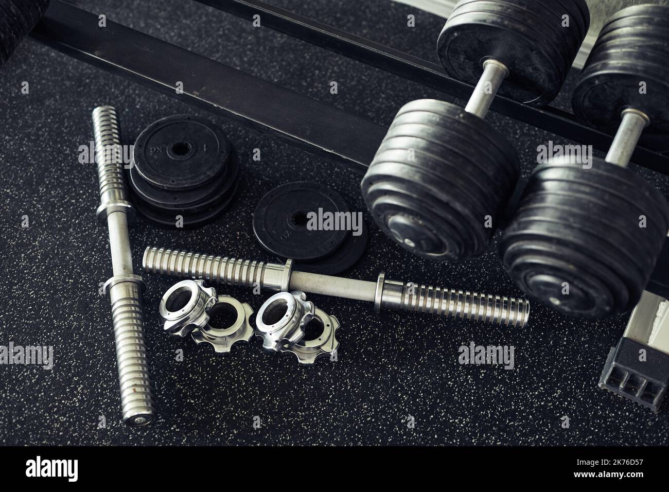 High angle view of metal details and dumbbells for sport training in gym Stock Photo