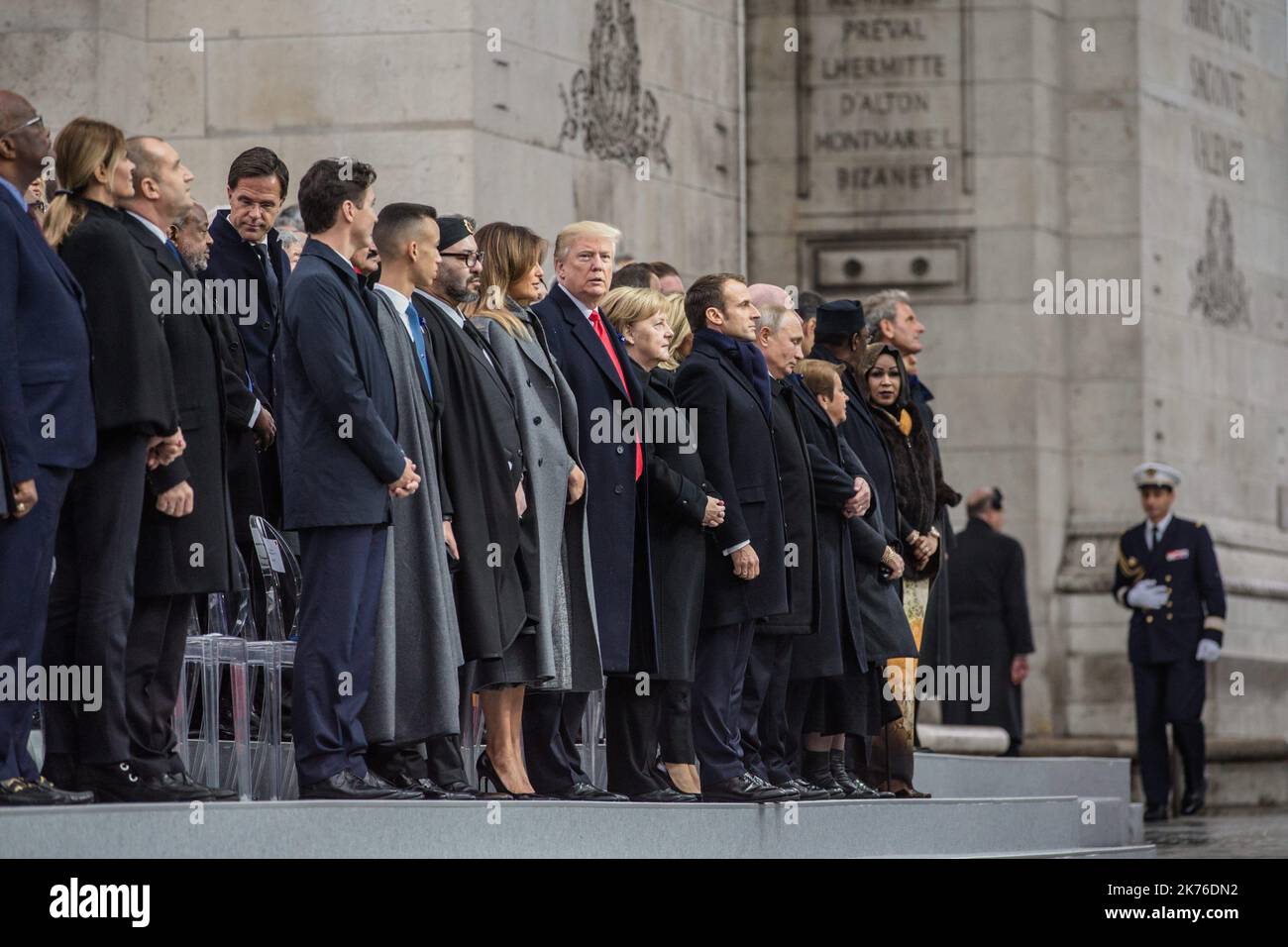 US President Donald Trump, Federal Chancellor of Germany Angela Merkel, French President Emmanuel Macron, Russian President Vladimir Poutine, accompanied by many foreign dignitaries attend a ceremony at the Arc de Triomphe in Paris on November 11, 2018 as part of commemorations marking the 100th anniversary of the 11 November 1918 armistice, ending World War I. Stock Photo