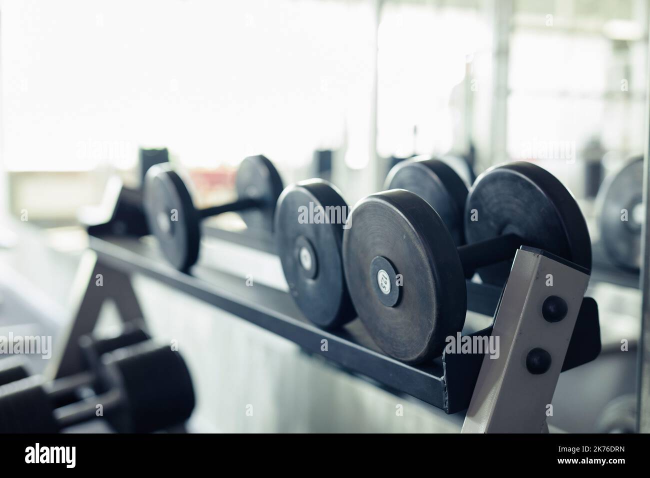 Close-up of metal dumbbells for sport training in gym Stock Photo