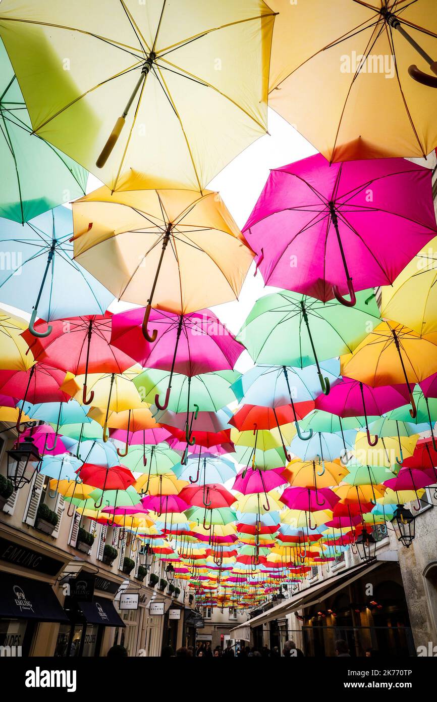 Sky of colorful umbrellas installed at Le Village Royal in Paris Stock