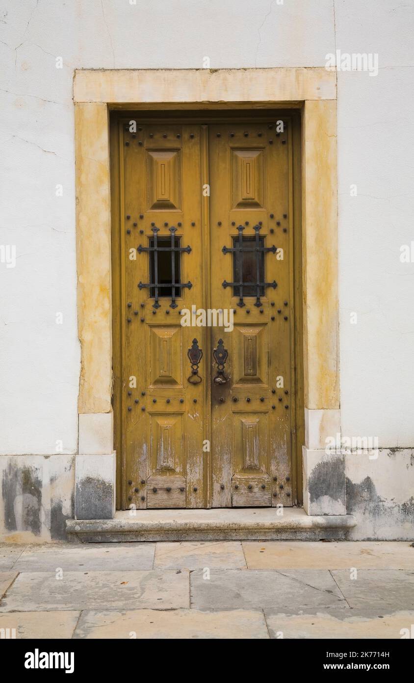 Medieval style entrance door to bulding on the Old University of Coimbra grounds, Coimbra, Portugal. Stock Photo