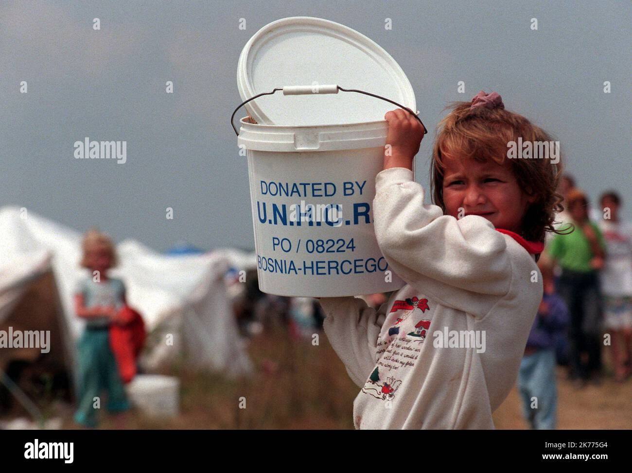 Thousands of Bosnian refugees from Srebrenica, mostly women and children, end up in Tuzla after fleeing the Srebrenica enclave recently invaded by Bosnian Serbs. Thousands of bosnian refugees from Srebrenica have converged on Tuzla after the safe haven of Srebrenica, which was recently overrun by the Bosnian Serbs. Stock Photo