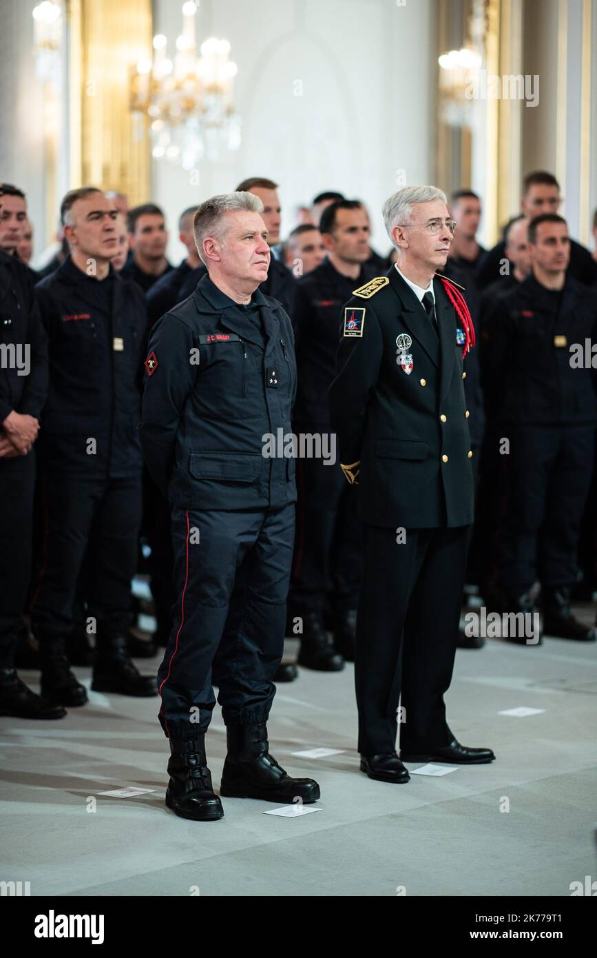 Paris fire brigade commander general Jean-Claude Gallet  and Paris police Prefect Didier Lallement attend during  French President Emmanuel Macron delivers a speech during thanks to the firefighters who intervened at Notre dame de Paris  Firefighters arrive at the Elysee palace on April 18, 2019 in Paris.   Stock Photo