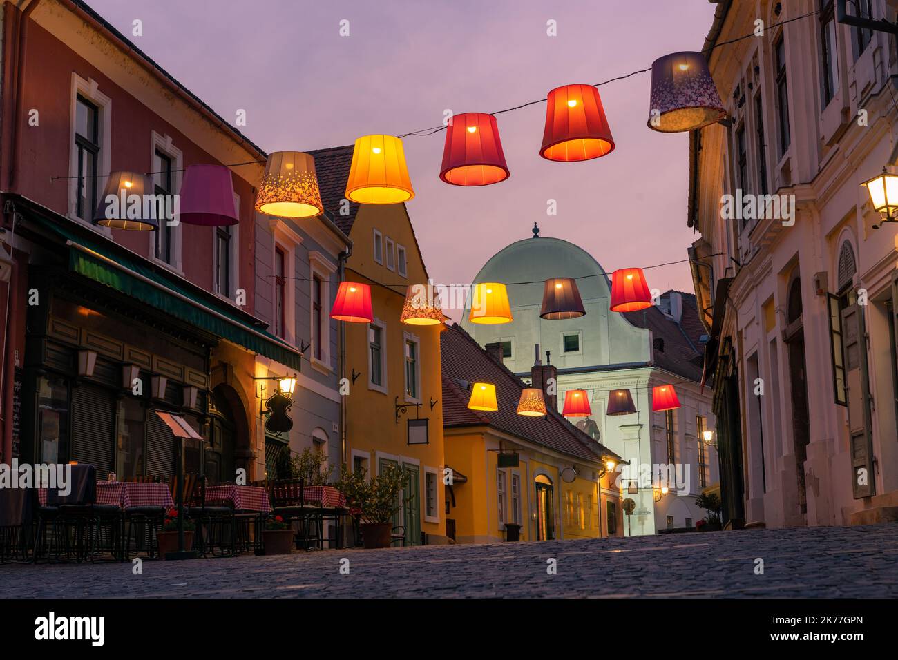Main square with beautiful city lights in Szentendre Hungary next to Budapest with colorful banner light decorations Stock Photo