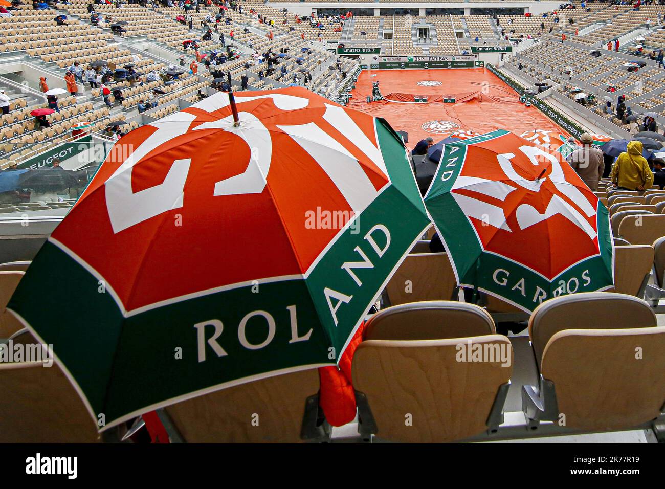 Covers are pulled over Court Philippe Chatrier due to a rain delay on ...