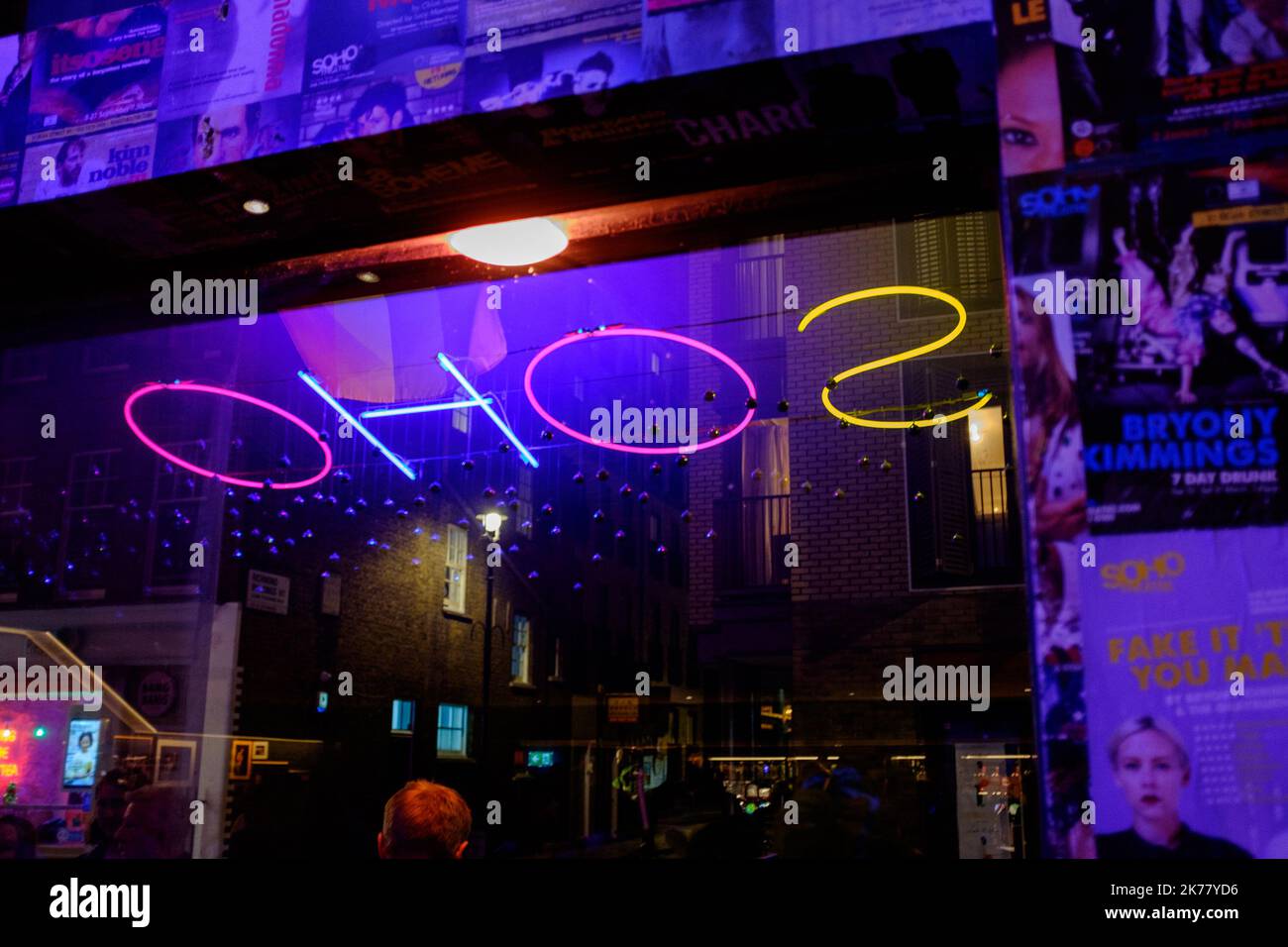 Atmospheric and illuminating neon Soho lettered sign at night time in London's Soho entertainment district, 2022 Stock Photo