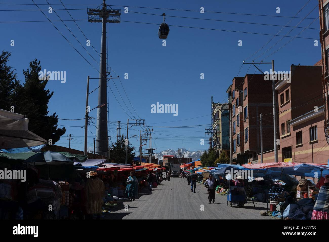 The largest and highest cable car network in the world, is trying to reduce the chaotic traffic of the Bolivian capital, La Paz. The ecological transport inaugurated in 2014 is controversial because it disrupts the privacy of the inhabitants who live where the line passes. Stock Photo
