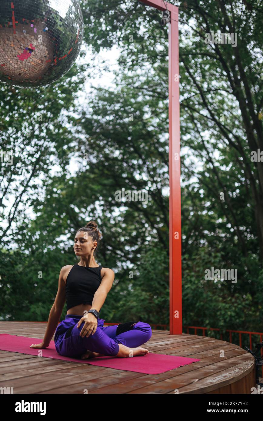 Young woman is practising yoga sitting in the lotus position Stock ...
