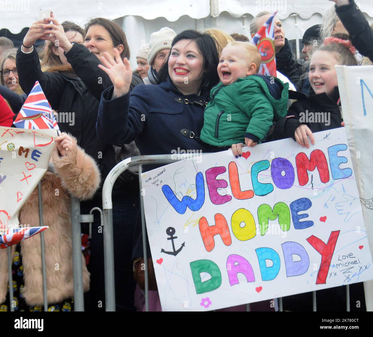 Claire Shannon and her son Michael 18 months welcome home dad PO Paul Shannon as the Royal avy's newest warship HMS Duncan returns tp Portsmouth after a nine month deployment supporting the us aircraft carrier  the USS Theodore Roosevelt in its operations against ISIL. Pic Mike Walker, Mike Walker Pictures,2015 Stock Photo