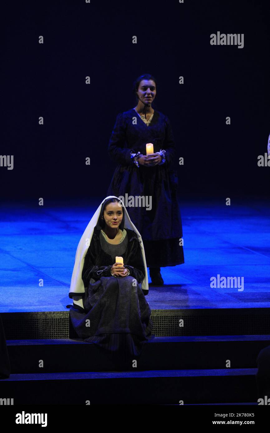 Lourdes, south western France, july 1st 2019 - Musical on Bernadette Soubirous. Saint Bernadette Soubirous (1844 – 1879), also known as Saint Bernadette of Lourdes, was the firstborn daughter of a miller from Lourdes, in the department of Hautes-Pyrénées in France, and is best known for experiencing Marian apparitions of a 'young lady' who asked for a chapel to be built at the nearby cave-grotto at Massabielle. These apparitions are said to have occurred between 11 February and 16 July 1858, and the lady who appeared to her identified herself as the Immaculate Conception. Stock Photo